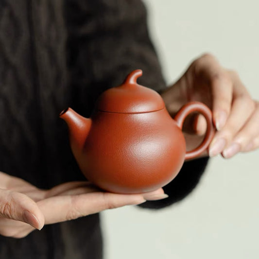 Yixing red porcelain Zhu ni small eggplant teapot