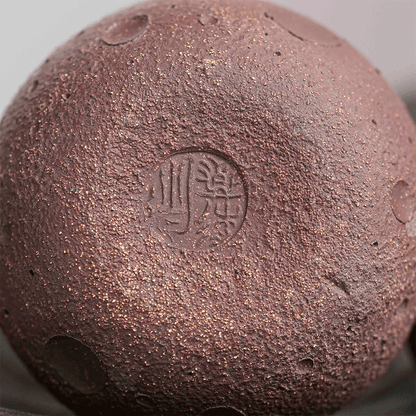 Raw purple clay teapot